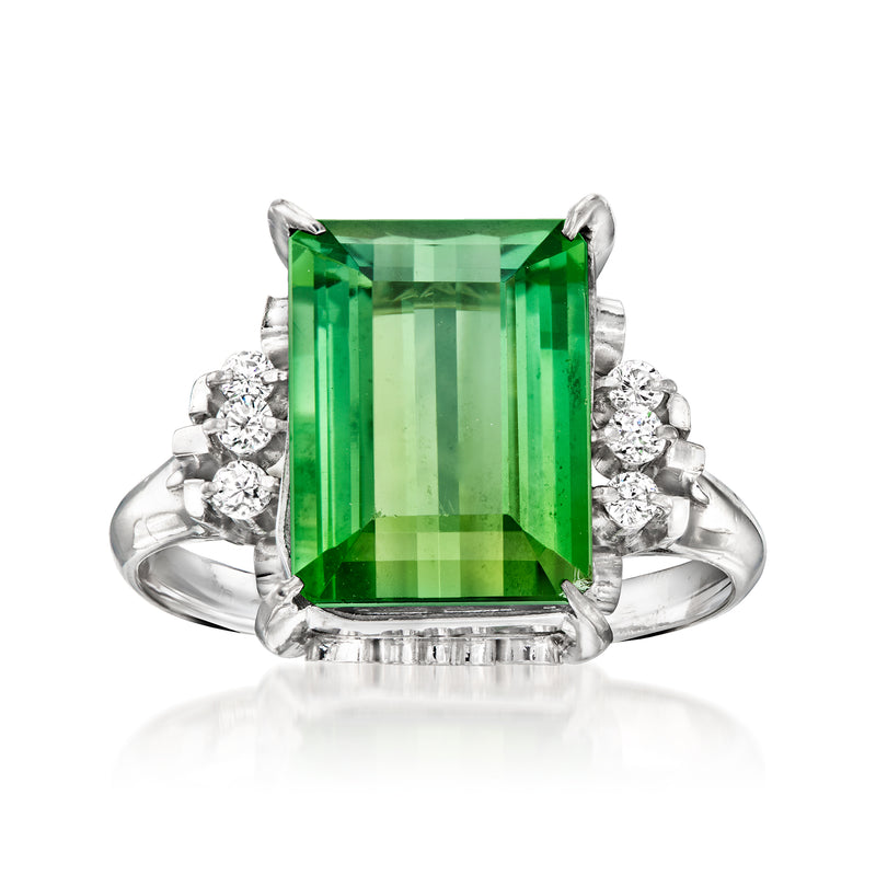 Platinum vintage ring with large emerald-cut green tourmaline and round diamond halo