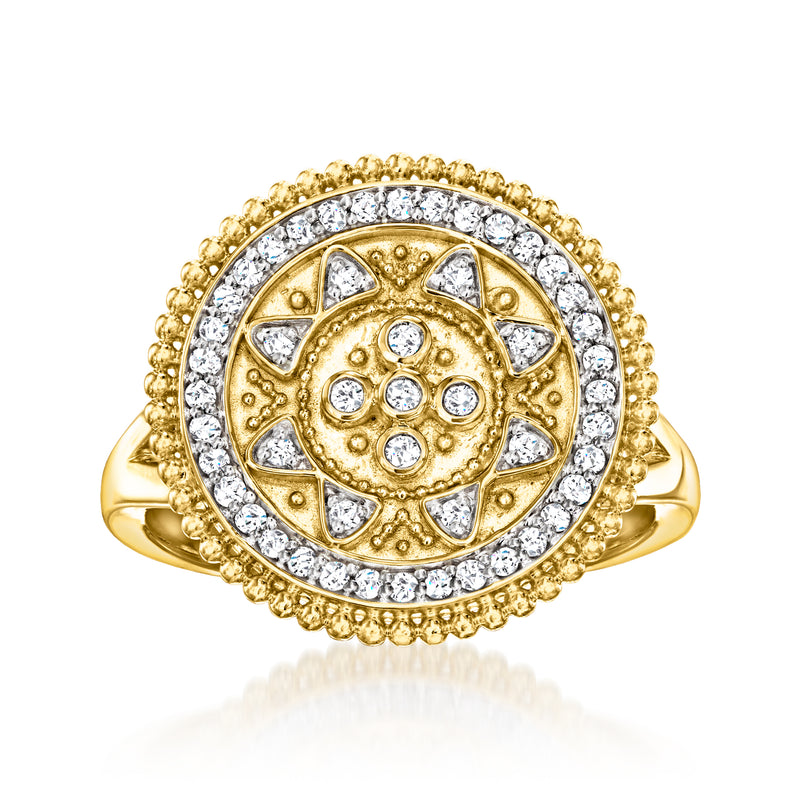 Gold-toned round halo ring with textured beaded edge and clear stone accents