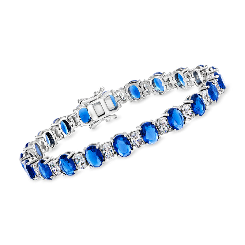 Sterling silver tennis bracelet with oval simulated sapphire and round CZ accents