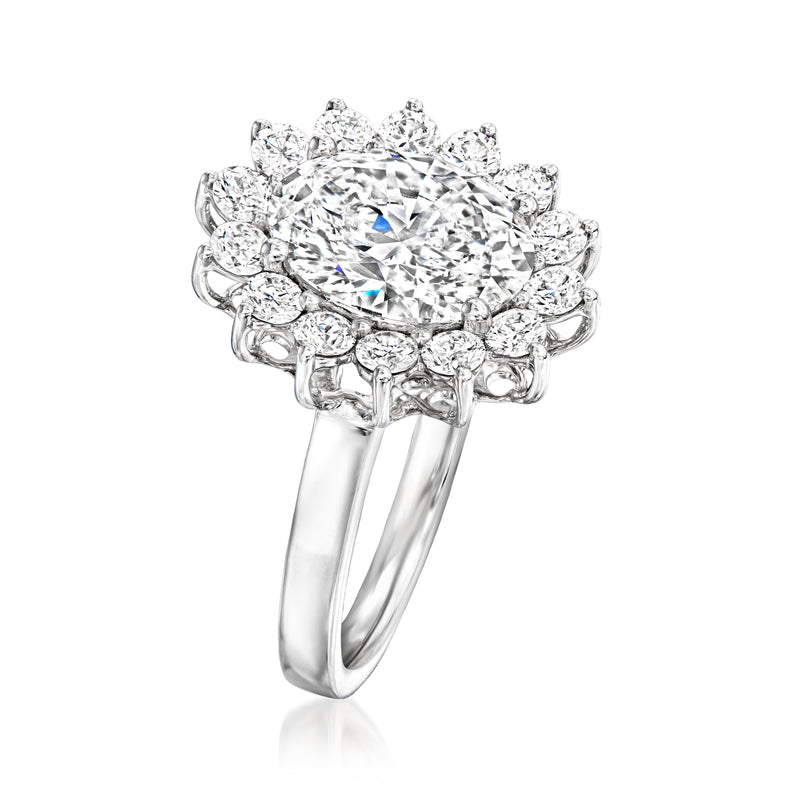 White gold diamond ring with cushion-cut center and layered halo setting