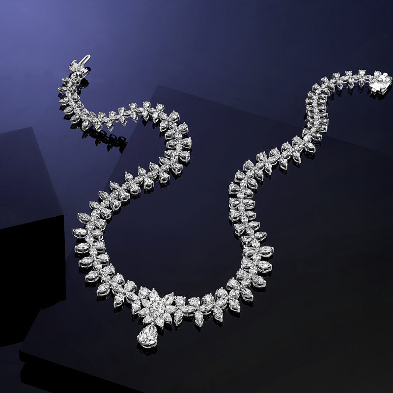 White gold diamond tennis-style necklace, marquise links with pear-shaped center drop