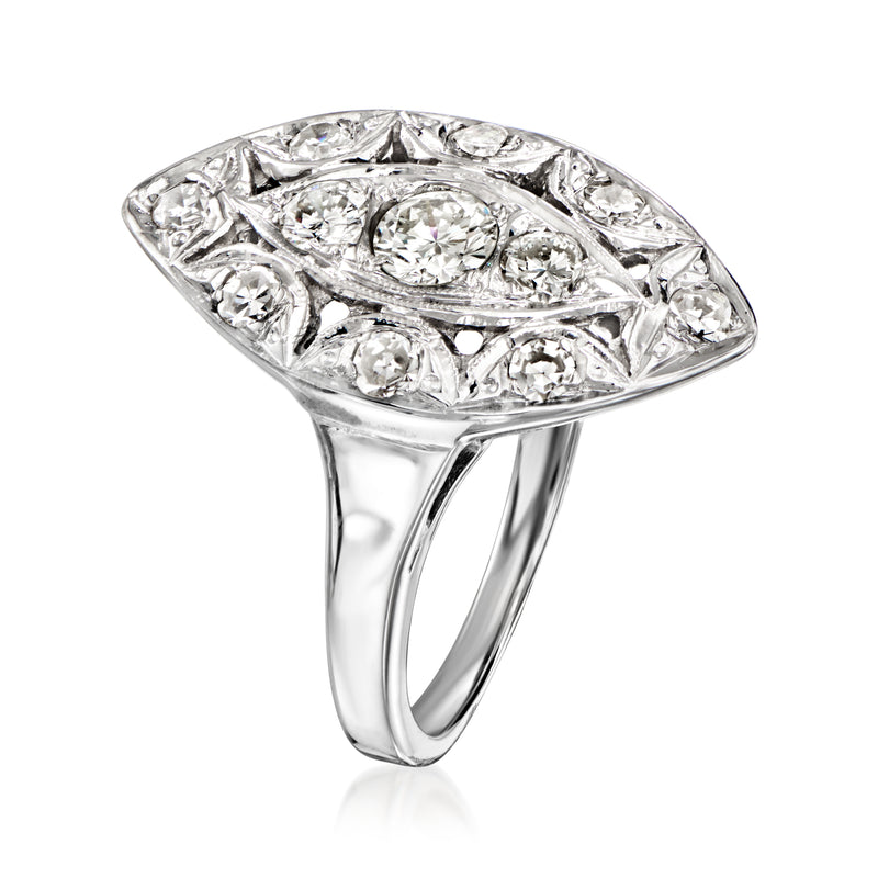 Navette diamond ring with oval marquise center, surrounded by round and marquise stones