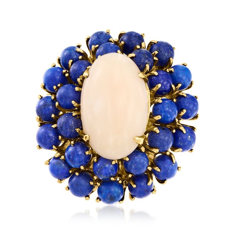 Gold cocktail ring with oval pale stone center and blue lapis cabochon cluster