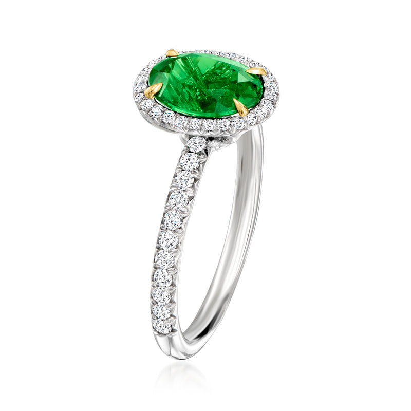 White gold diamond band with oval green center stone halo and gold prongs