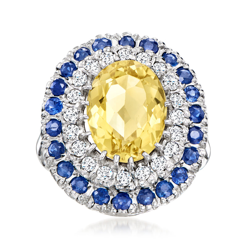 Yellow beryl ring with blue sapphire and diamond halo in white gold