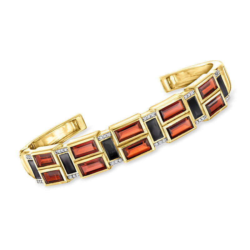 18kt gold cuff bracelet with red garnet stones, black enamel, and white topaz accents
