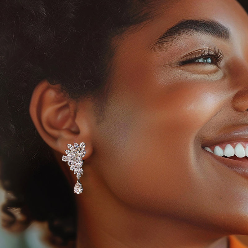 Lab-grown diamond cluster drop earrings in 14kt white gold on model, pear dangles