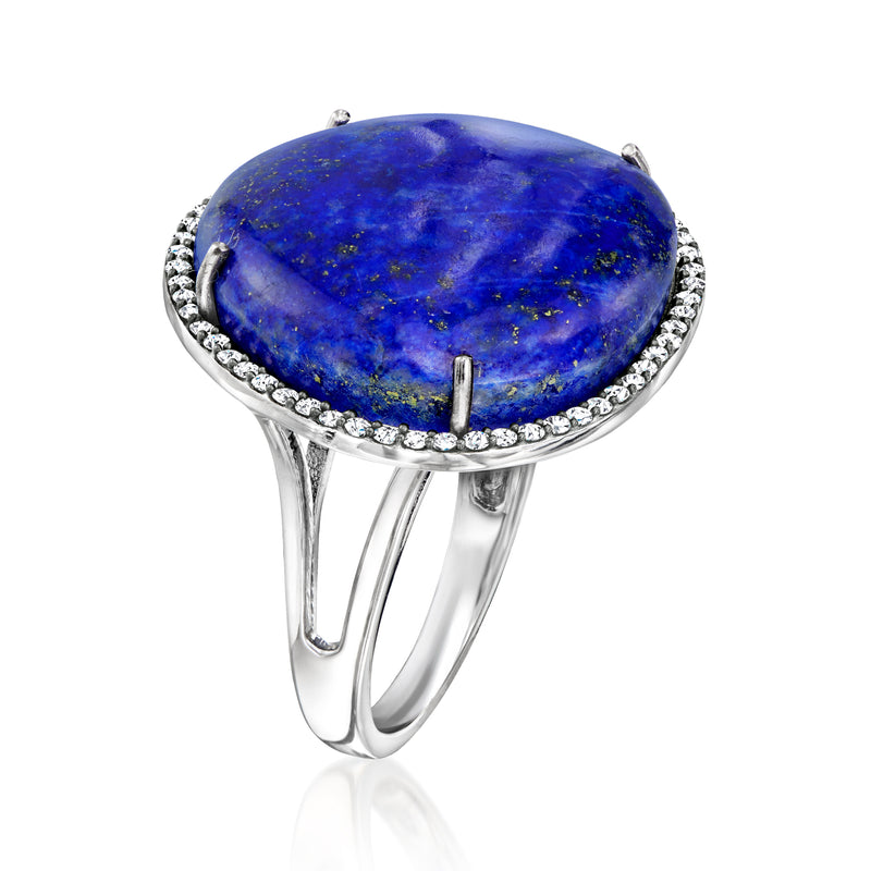 Sterling silver ring with oval lapis cabochon and white zircon halo