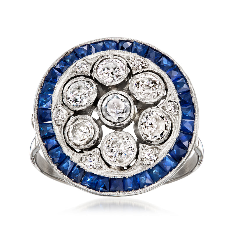Platinum disc ring with blue sapphire bezel and round diamond halo