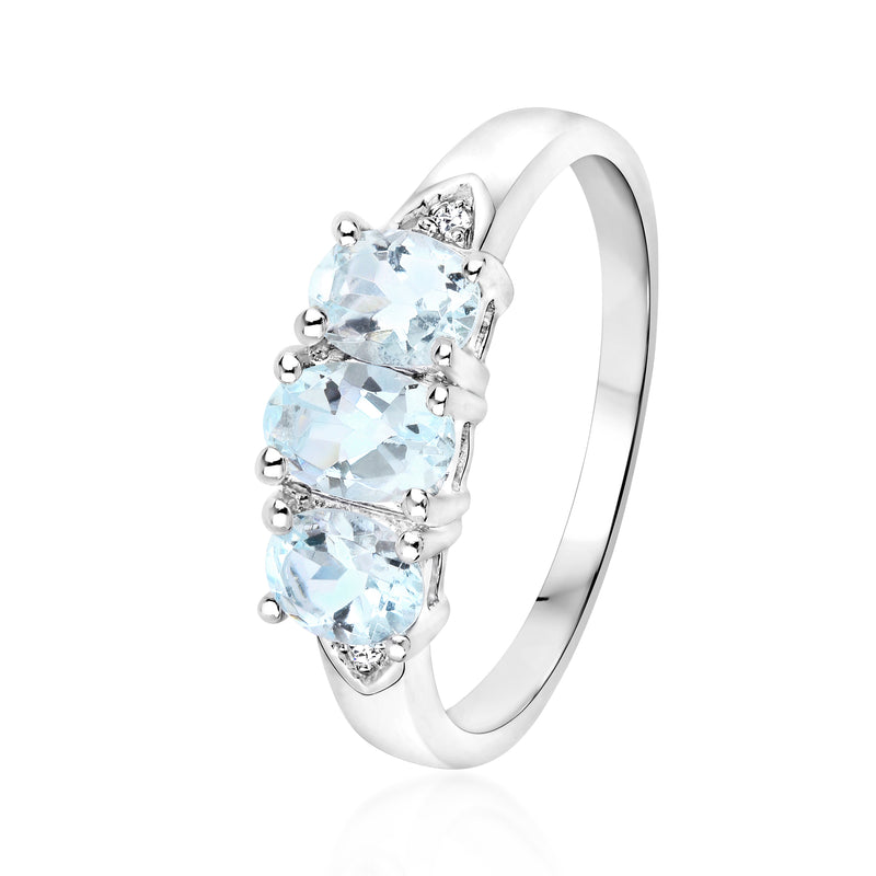 Sterling silver three-stone aquamarine ring with diamond side details and open band profile