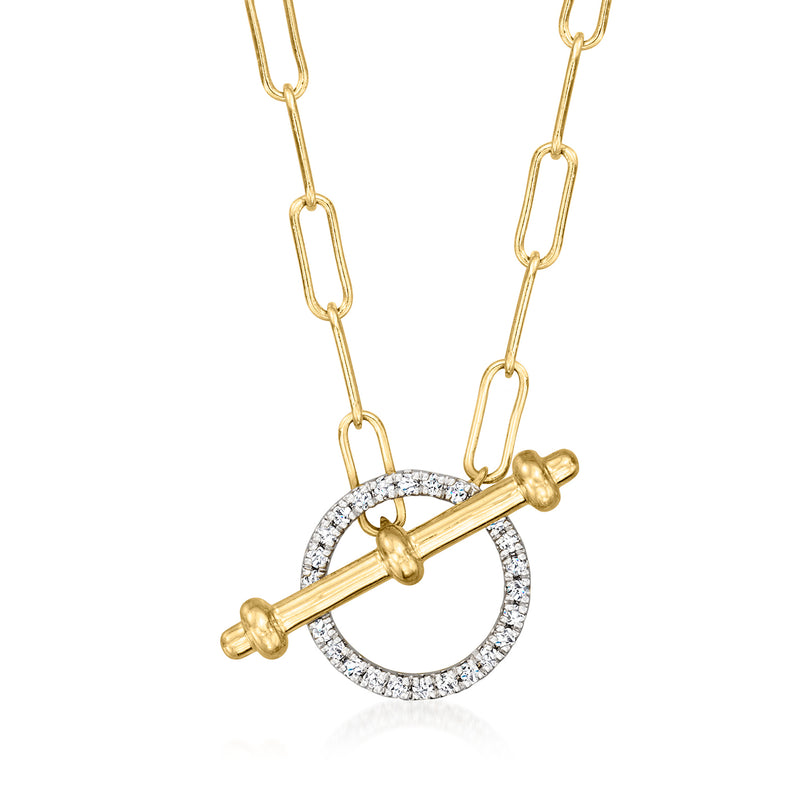 Gold toggle necklace with circular diamond halo pendant on a chain