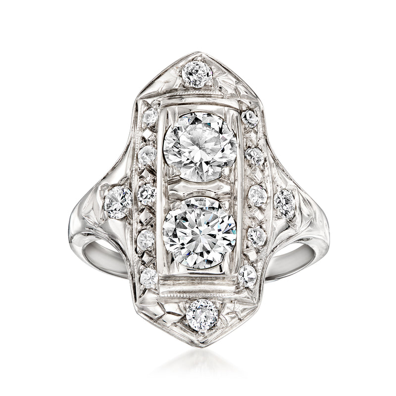 Vintage diamond dinner ring in 14kt white gold with ornate halo and round center stones