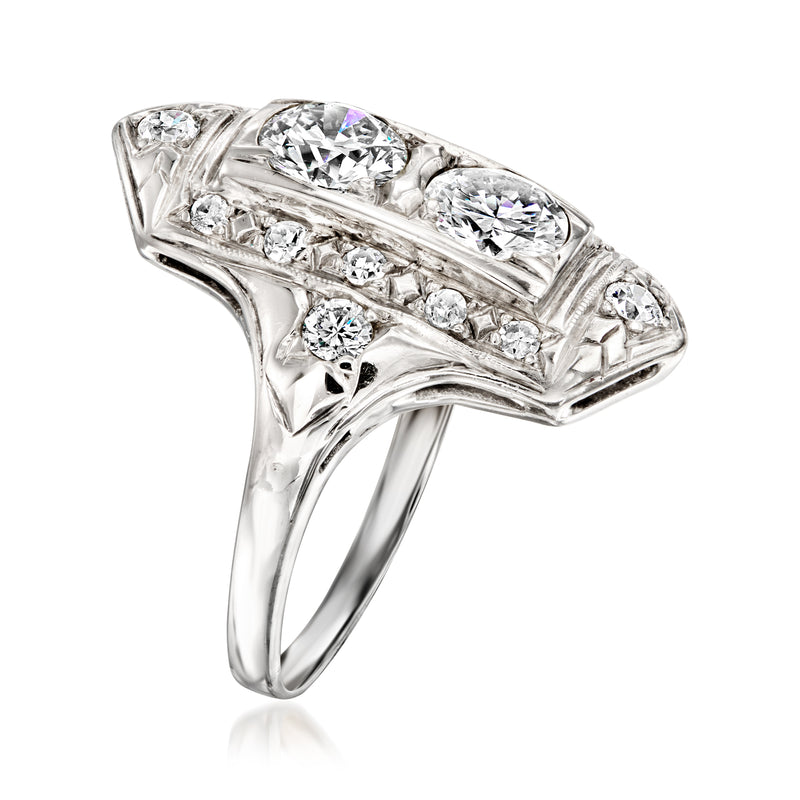 White gold diamond cocktail ring, rectangular setting with side baguette and small round stones