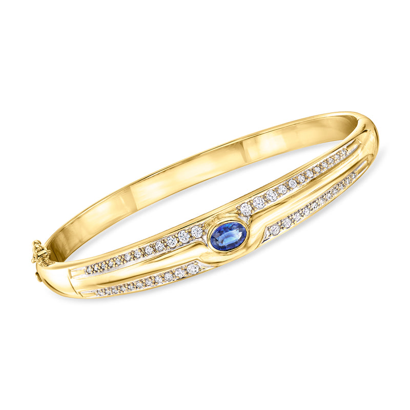 18kt yellow gold bangle bracelet with blue sapphire center and diamond accents