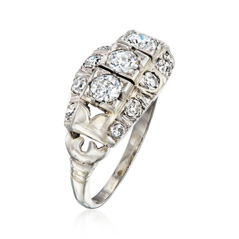 Side view of white gold diamond filigree ring with five round-cut stones