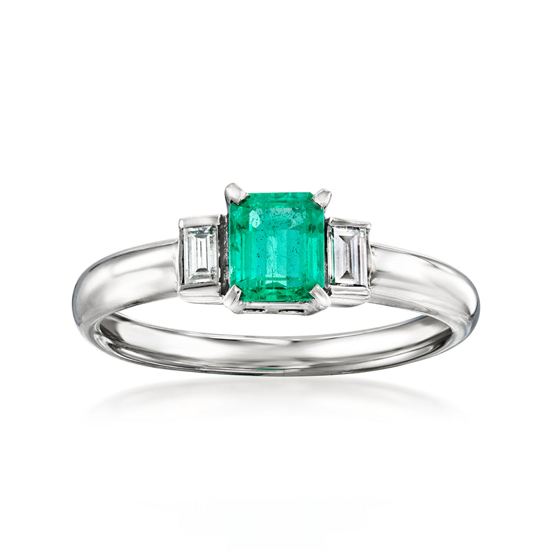 Platinum ring with emerald-cut green emerald center and diamond side baguettes