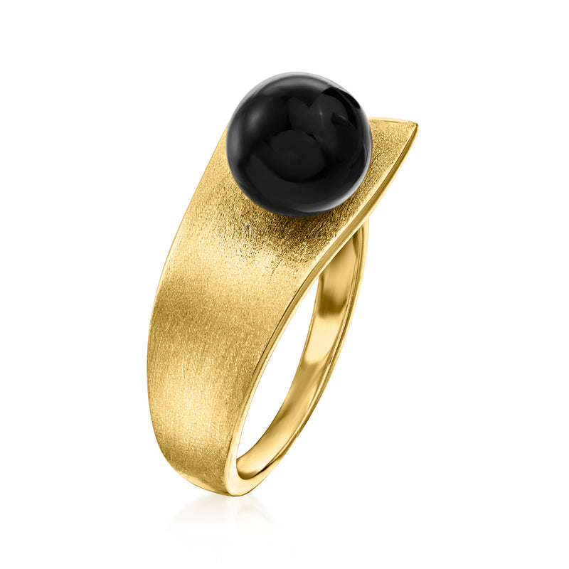 Gold wrap ring with oval black onyx center and textured band, slim open shank
