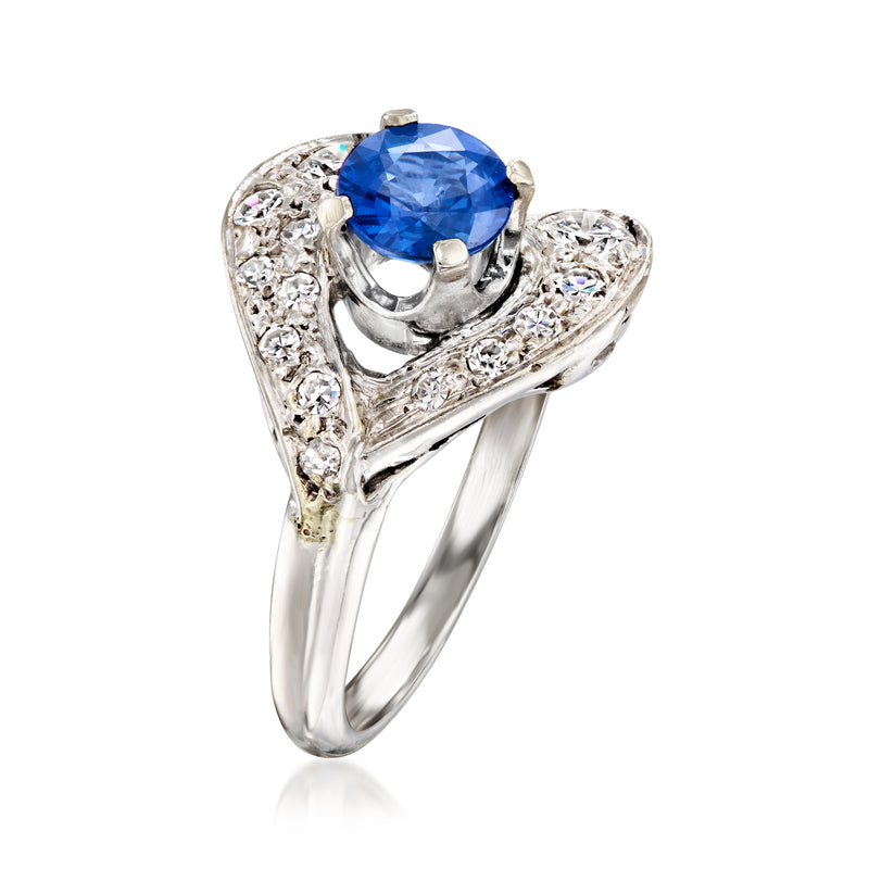 Vintage sapphire and diamond ring in white gold with a round blue center stone
