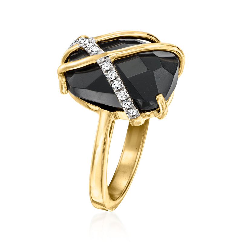 Gold-tone ring with faceted black oval stone, white topaz accents on prongs