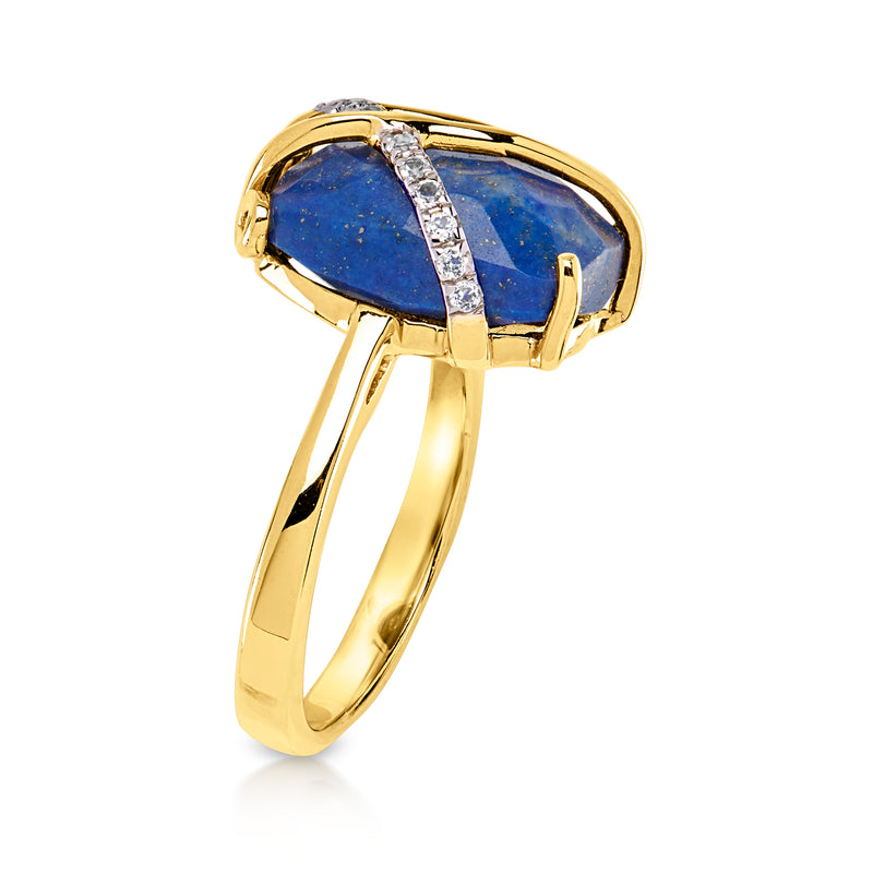 Gold-tone ring with oval blue stone bezel and white stones, angled view