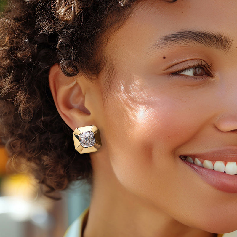 Octagonal diamond stud earrings with platinum-bordered center on ear