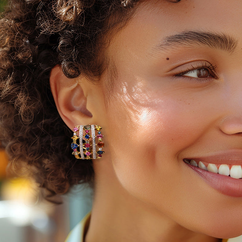 Multicolored gemstone earrings worn on ear, diamond-set 18k yellow gold bezel