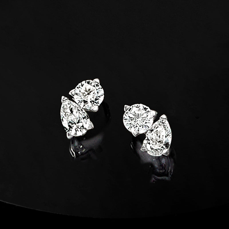 Toi et moi diamond stud earrings with two clear stone clusters on 14kt white-gold posts