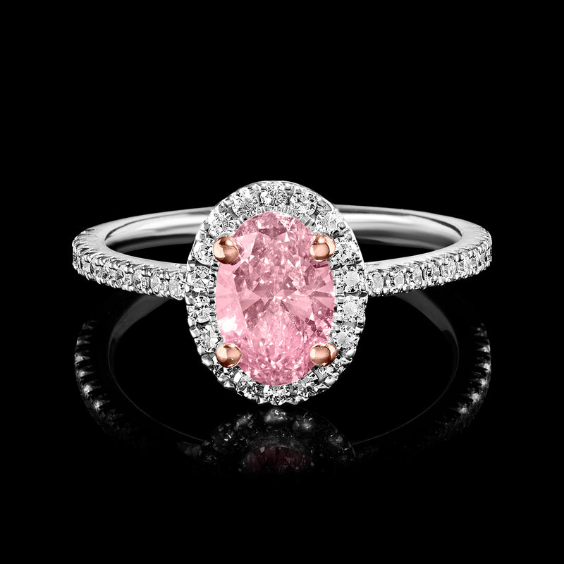 Pink and white diamond ring in 14kt white gold with oval pink center stone