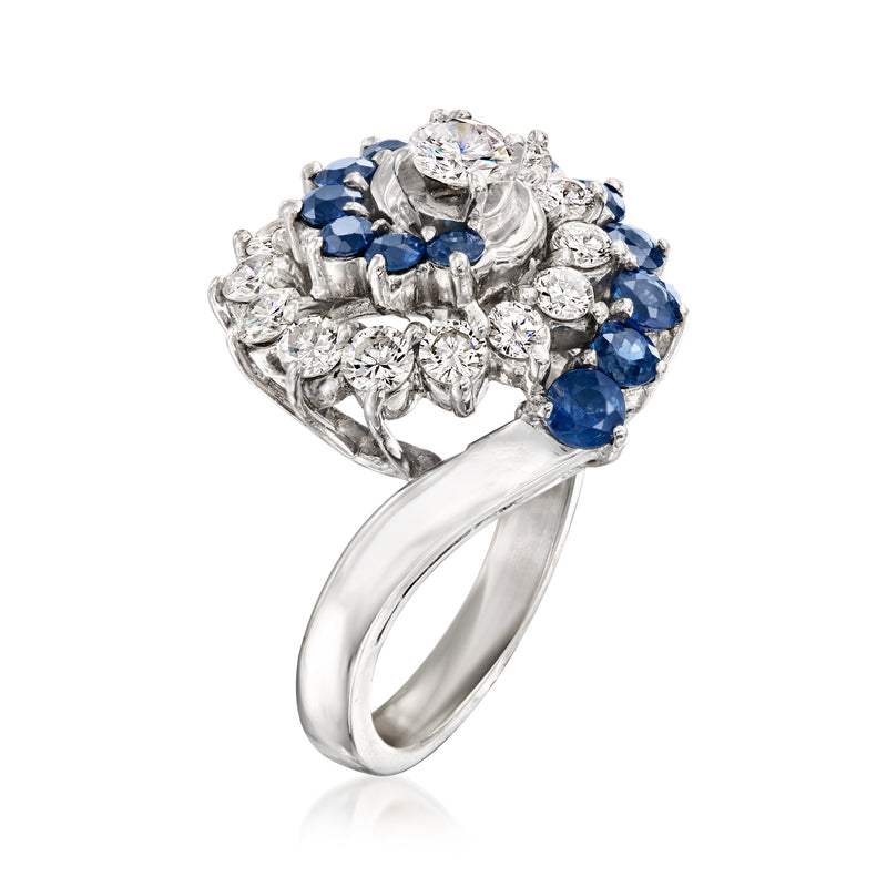 14kt white gold swirl ring with blue sapphires and diamond halo, openwork band