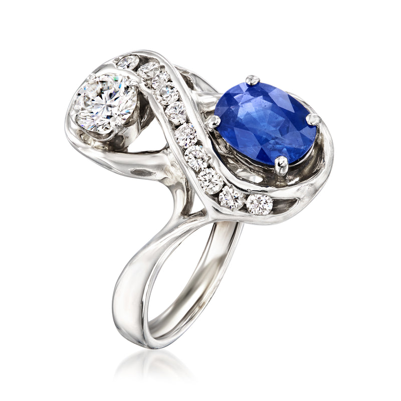 White gold oval sapphire ring with round diamond accents on twisted setting
