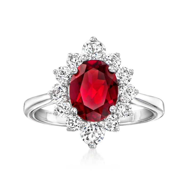 Sterling silver ring with red garnet center and white topaz halo