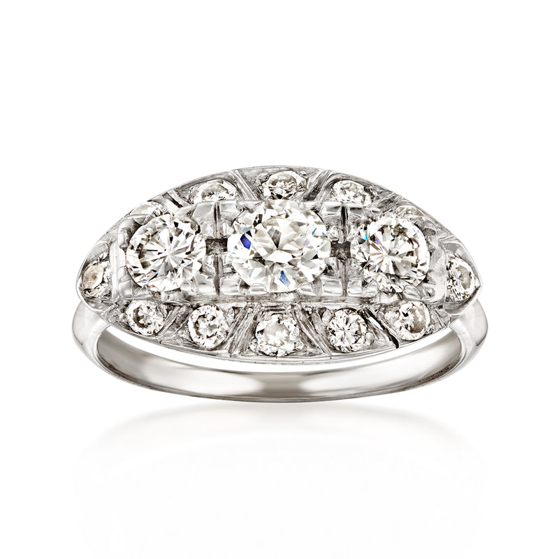 Vintage white gold diamond ring with oval cluster of round and baguette-cut stones