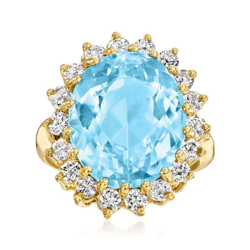 18kt yellow gold cocktail ring with large oval Swiss blue topaz and diamond halo
