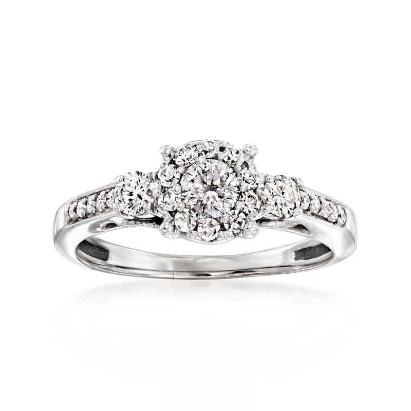Vintage 14kt white gold diamond ring with three-stone round cluster and pave band