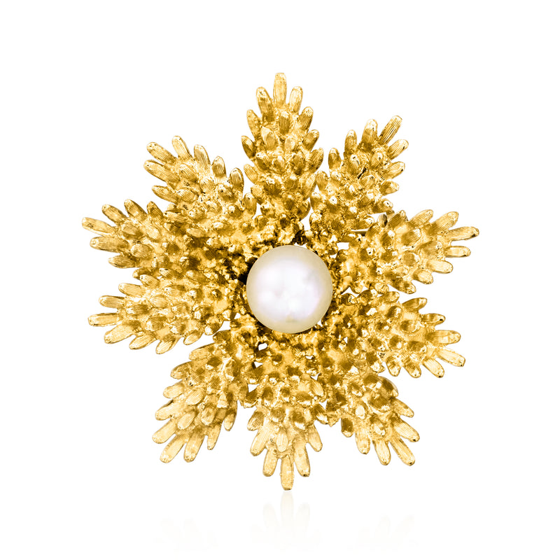 Gold flower pin with textured petals and a white cultured pearl center