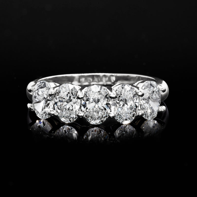 Top view of white gold five-stone diamond ring with five round-cut diamonds