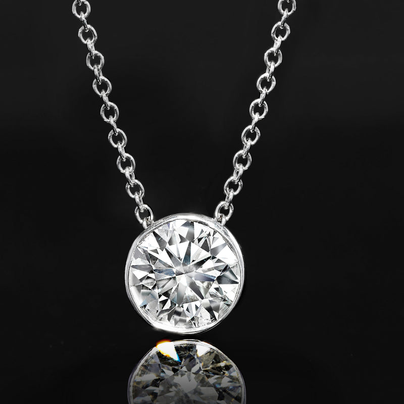 Round bezel-set lab-grown diamond pendant with linked chain, bright faceted center stone