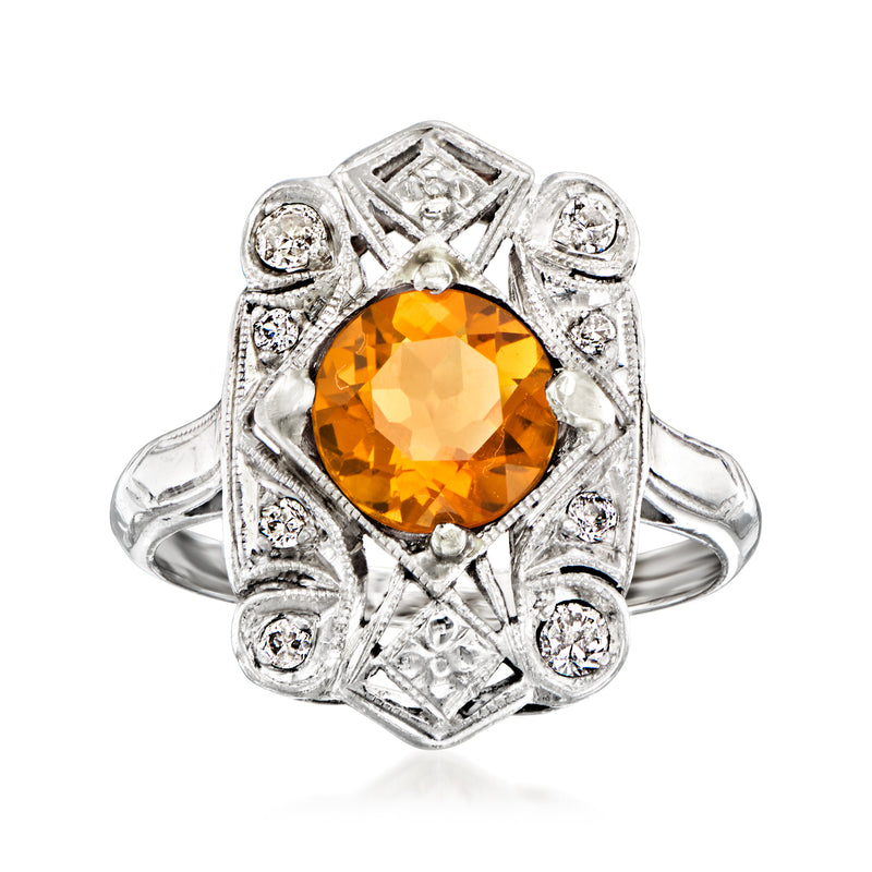 Vintage platinum filigree ring with orange citrine center and round diamond accents