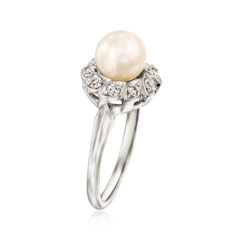 White gold ring with large round pearl and prong-set diamond cluster on slim band