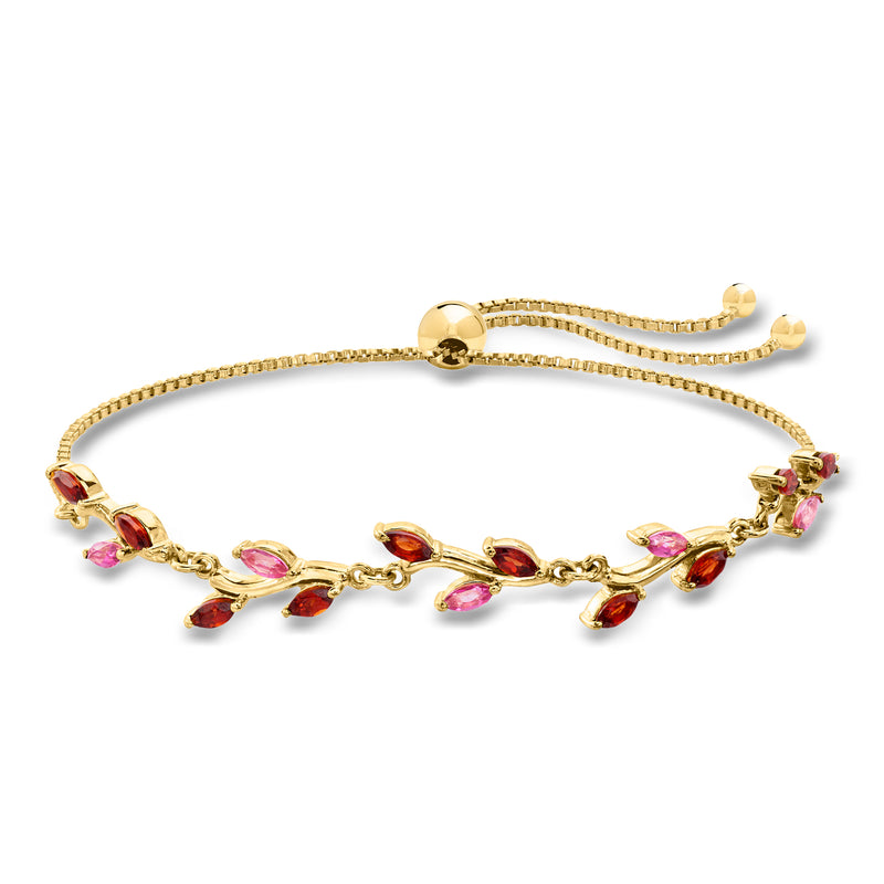 Gold bolo bracelet with leaf charms and pink and red gemstones