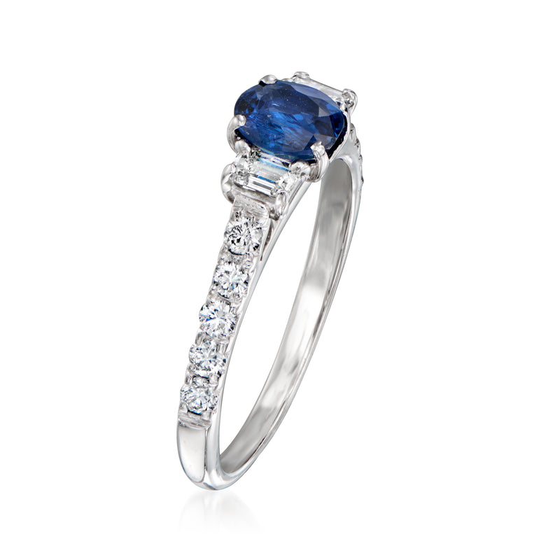 White gold ring with blue oval sapphire center and baguette-cut diamond side stones