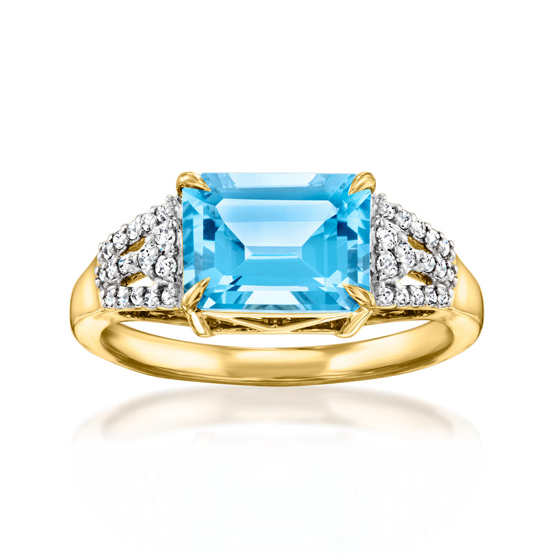 18kt yellow gold ring with emerald-cut Swiss blue topaz and diamond sides