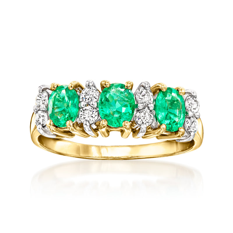 14kt yellow gold vintage ring with three emerald-green gemstones and diamond accents