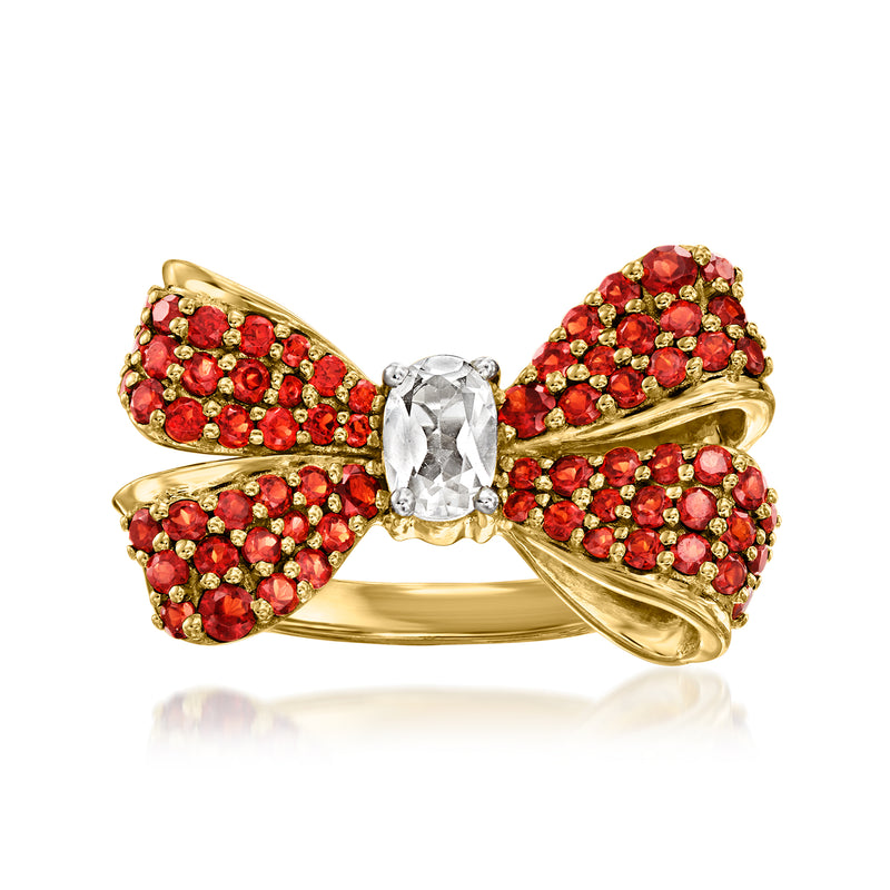 Bow ring with white topaz and red garnet in gold