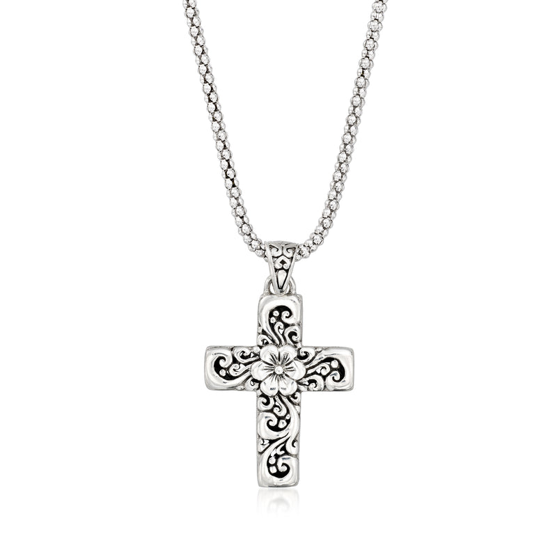 Silver cross pendant necklace with Bali-style floral details and chain