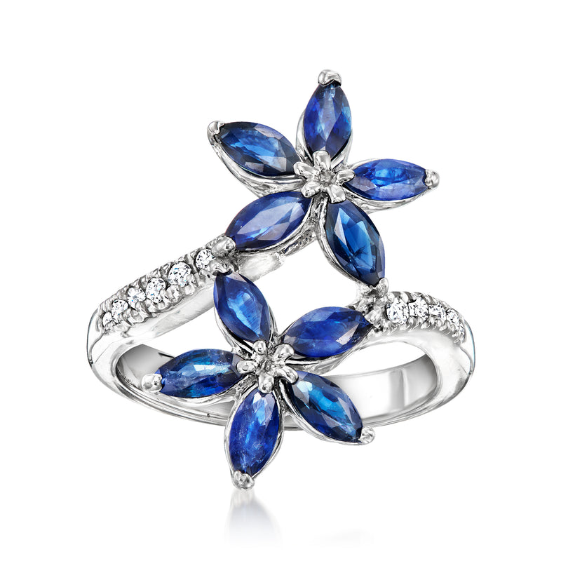 14kt white gold bypass flower ring with blue sapphire petals and diamond accents