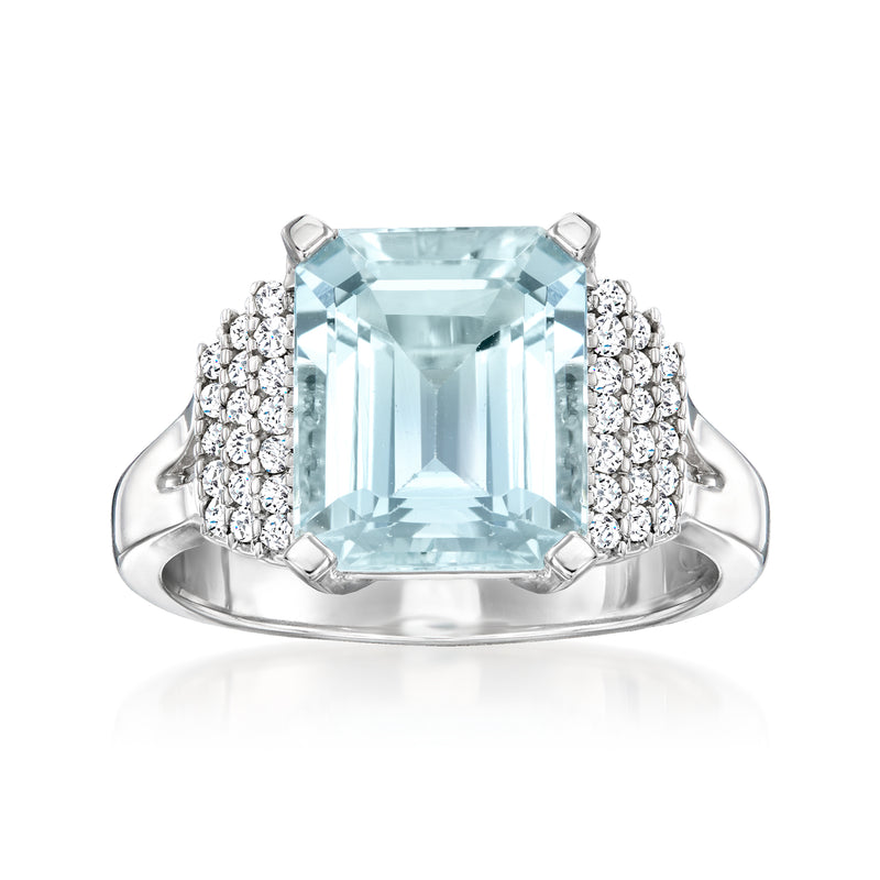 14kt white gold ring with emerald-cut aquamarine center and diamond halo, split shoulders