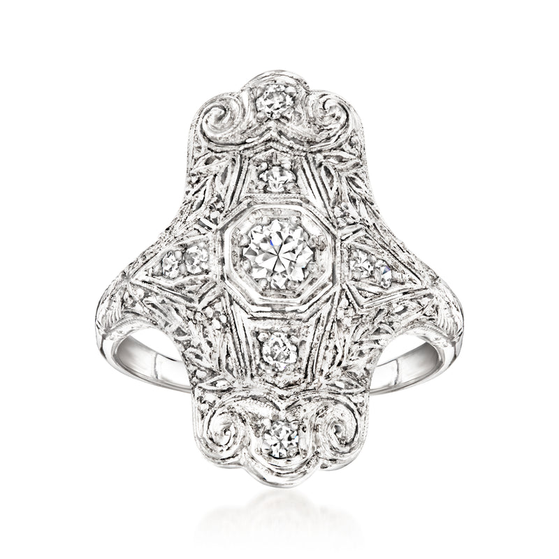 Vintage diamond filigree ring with central round stone and ornate platinum setting