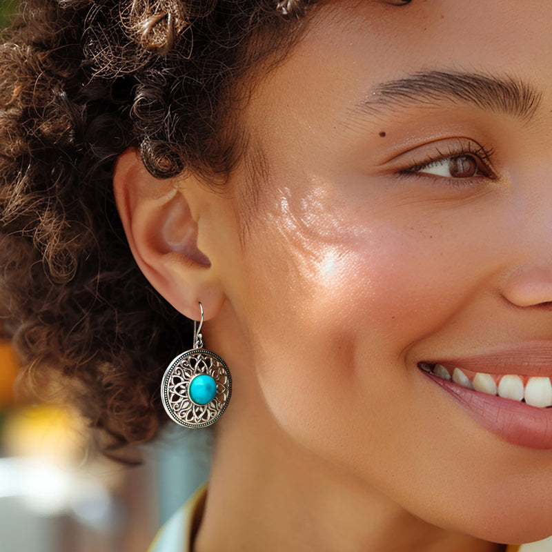 Turquoise-centered filigree drop earrings in sterling silver, on earwire