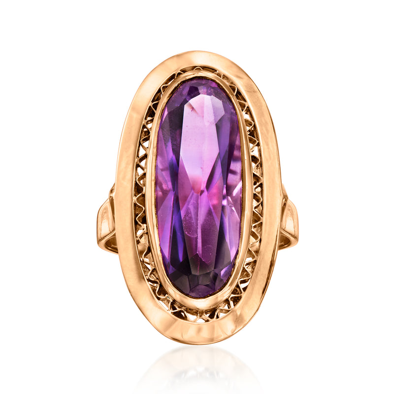 Vintage oval purple sapphire ring in 18kt yellow gold with ornate bezel